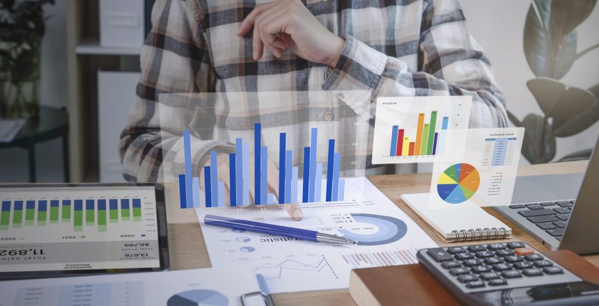 Businesspeople working in finance and accounting Analyze financial graph budget and planning for future in office room.